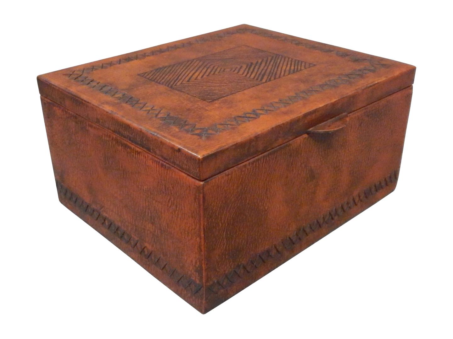 leather box with a sewed around the box and a tribal design on top